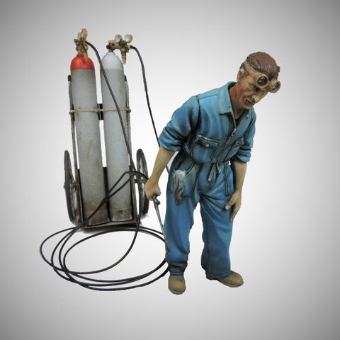 Tank mechanic with oxyacetylene cart